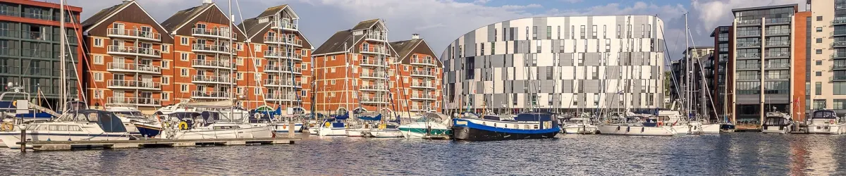Modern co-working rooftop at golden hour with blurred city skyline in the background
