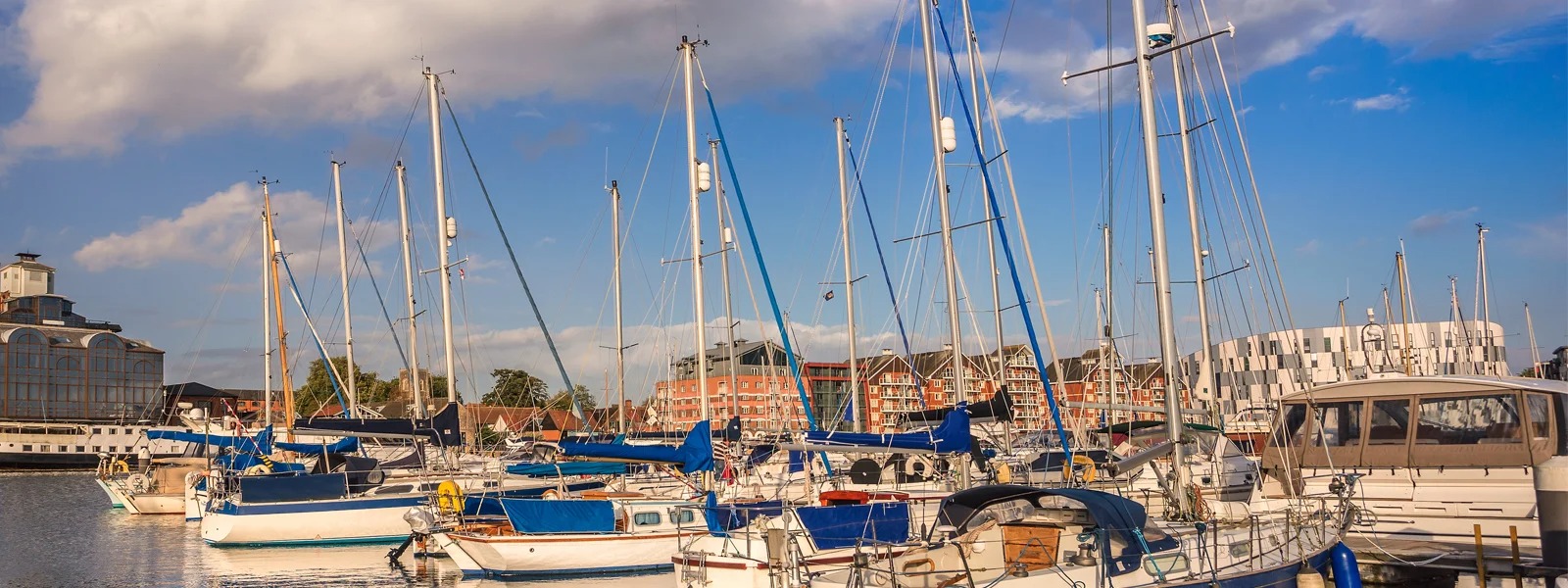 Modern co-working rooftop at golden hour with blurred city skyline in the background