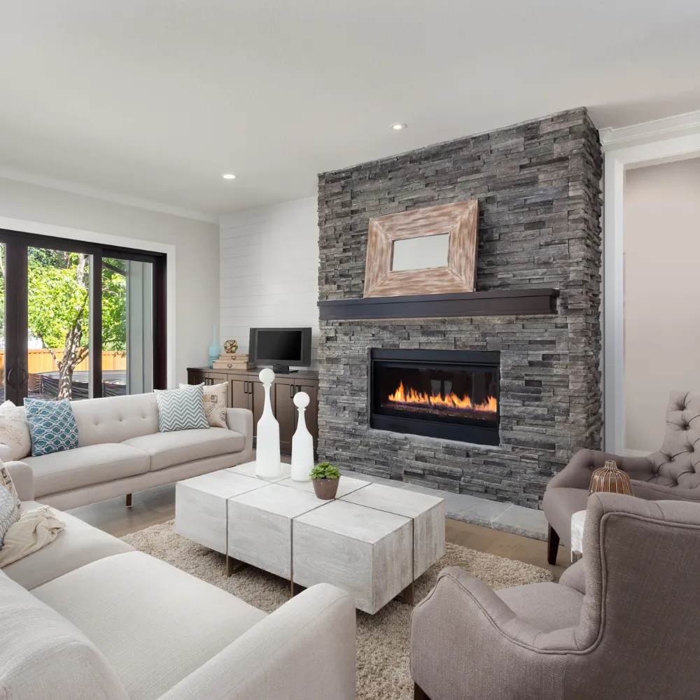 Interior home renovation in Logan Utah with updated living space, fireplace, and open layout design