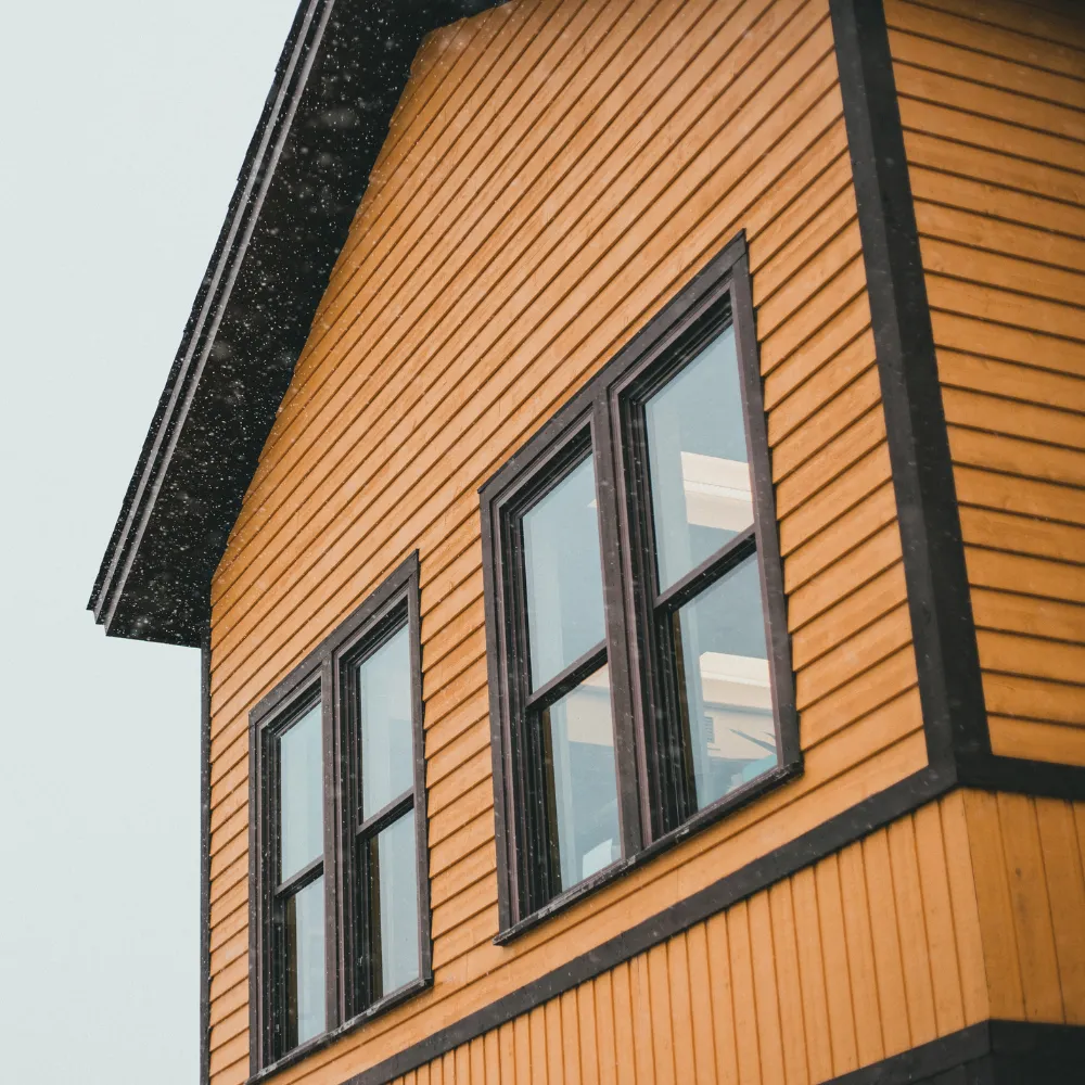 Exterior home renovation in Logan Utah with new siding, windows, and modern curb appeal upgrades
