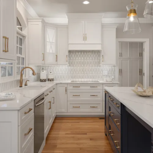 Modern kitchen remodel with white shaker cabinets and quartz countertops