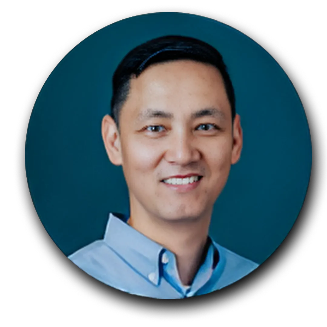Person in a blue shirt against a blue background.