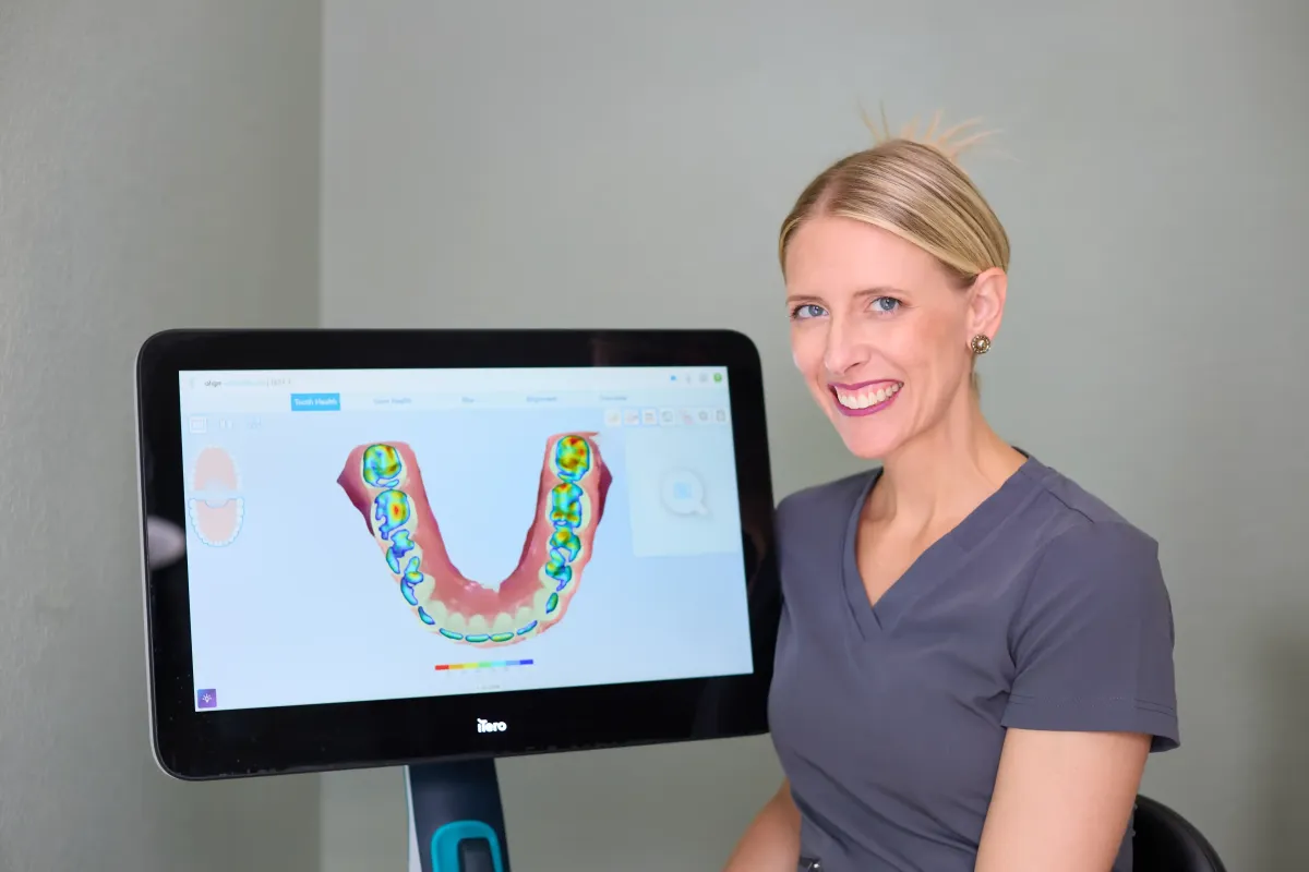 Dr. Cyndi Blalock showing a digital smile simulation on an iTero scanner at her St. Peters dental office