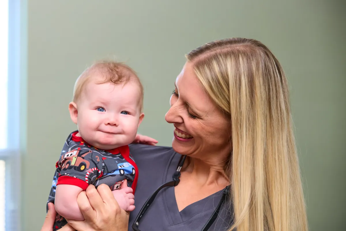 Dr. Cyndi enjoying an infant dental checkup at Cardinal Dental in St. Peters, MO