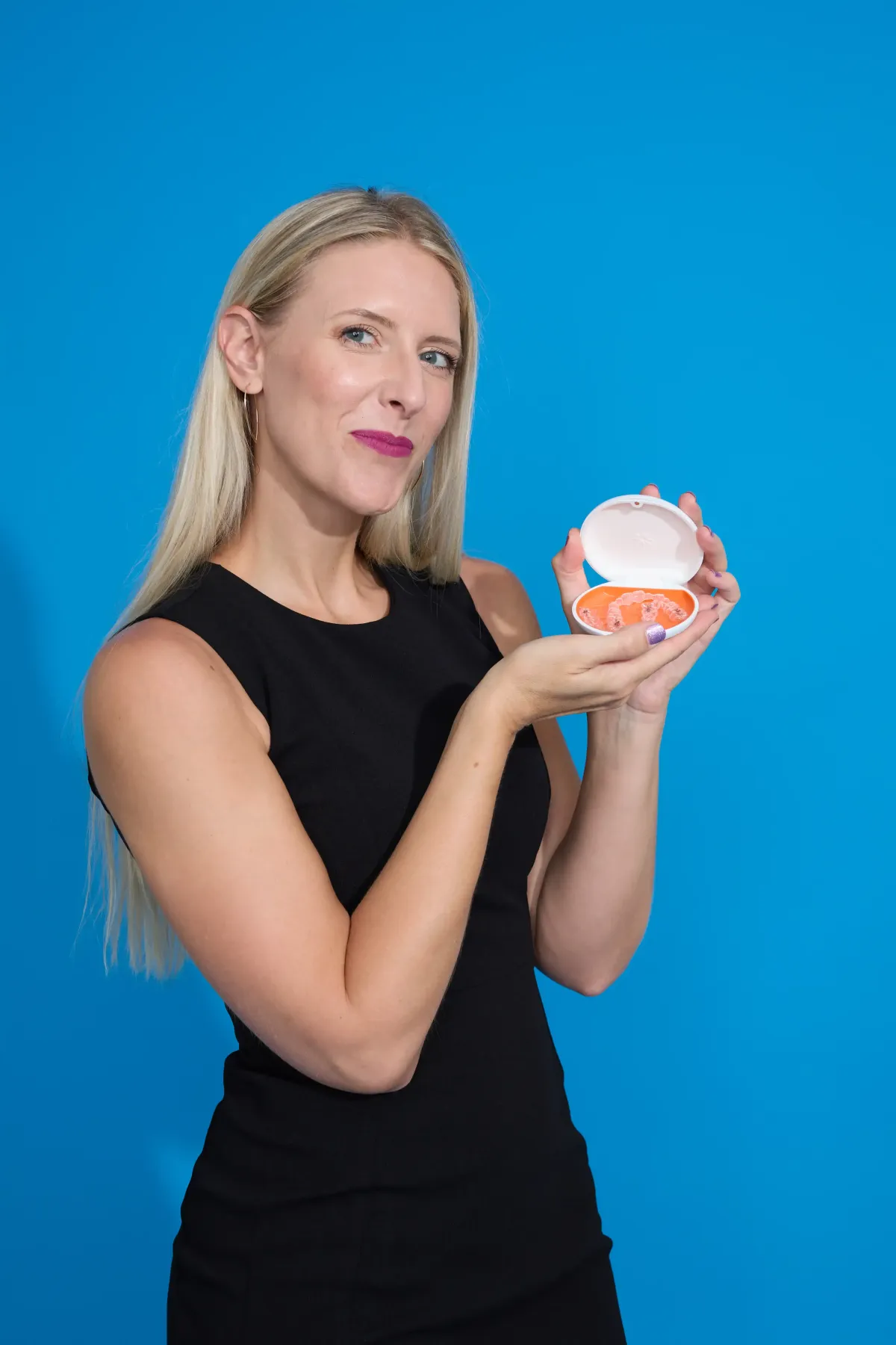 Dr. Cyndi Blalock DDS smiles with Invisalign clear aligners in the Cardinal Dental of St. Peters MO dental clinic