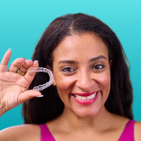 Patient showing clear Invisalign aligners from Platinum Plus Provider in St. Peters MO