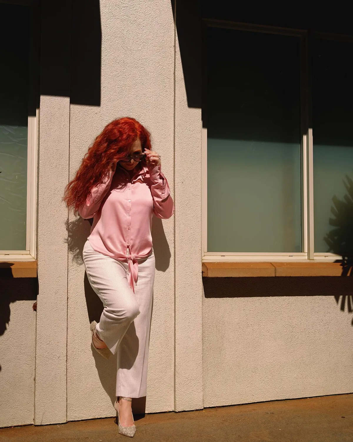 Allyson Chavez standing against the wall