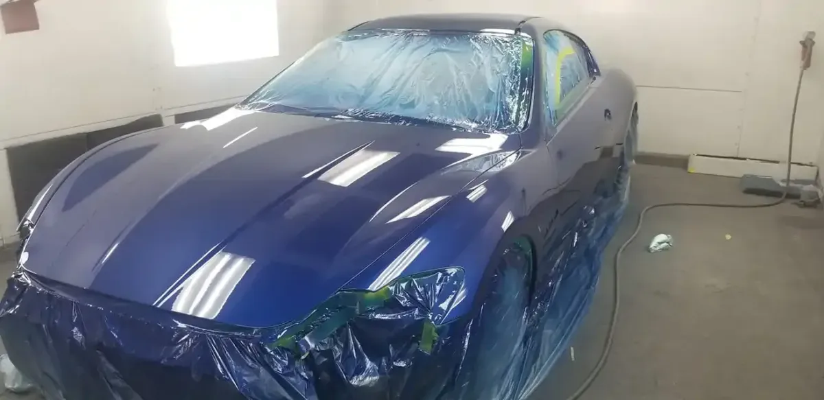 painting a car blue and refinishing in our body shop