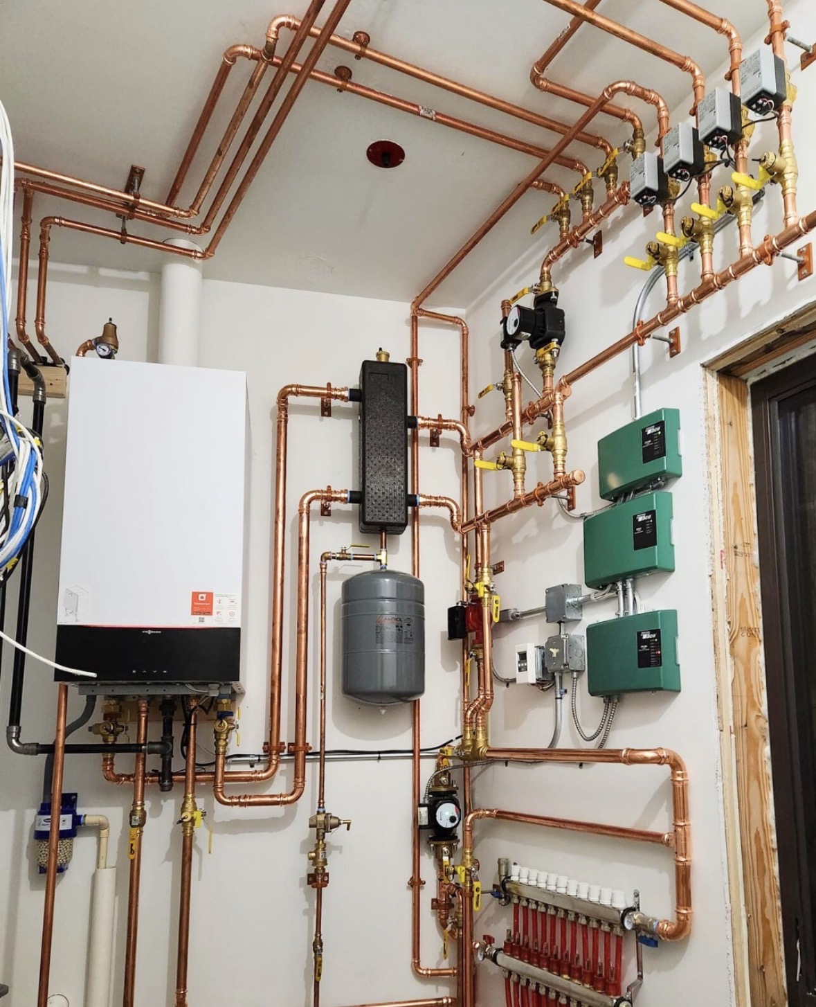 Residential water heater and filtration system installed on interior wall