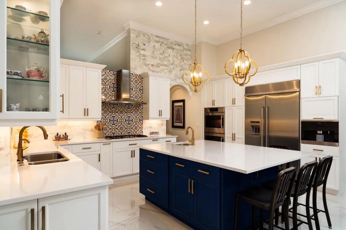 Modern kitchen renovation with blue cabinets and new plumbing fixtures