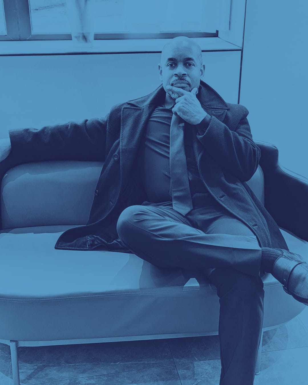 A welcoming office reception area in Frederick, with a modern desk, local business brochures, and a large window showing a tree-lined street. The space feels open, inviting, and ready for new clients to connect.