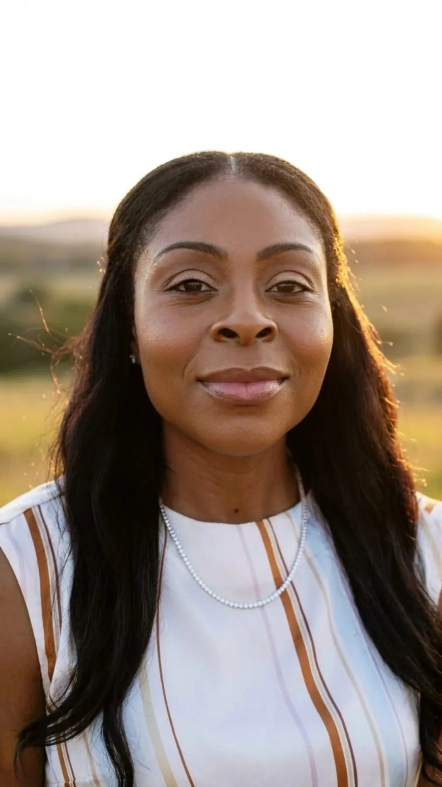 Person standing confidently after overcoming challenges, symbolizing resilience, growth, and a fresh start after hitting rock bottom