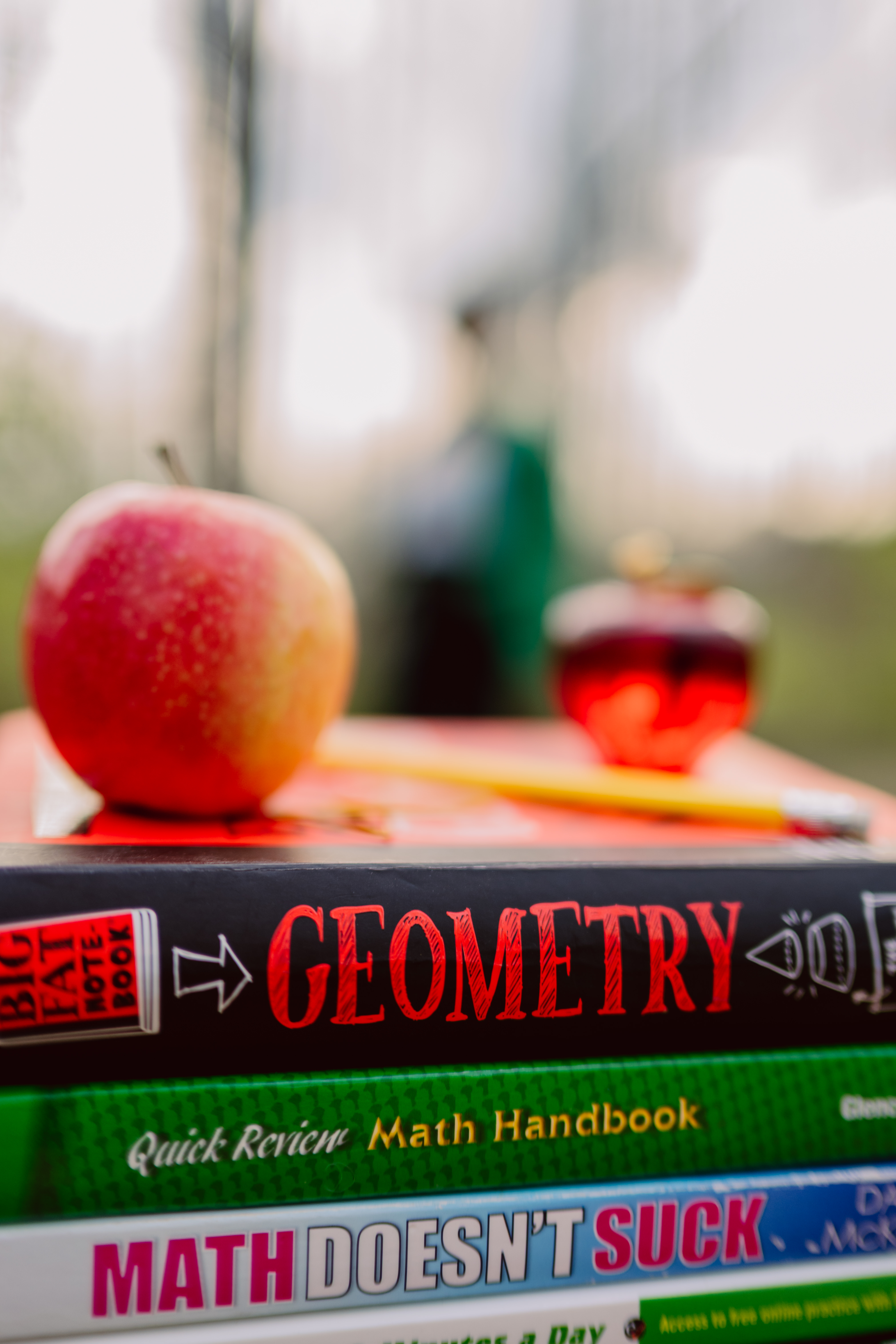 Math Textbooks with Tutor in background