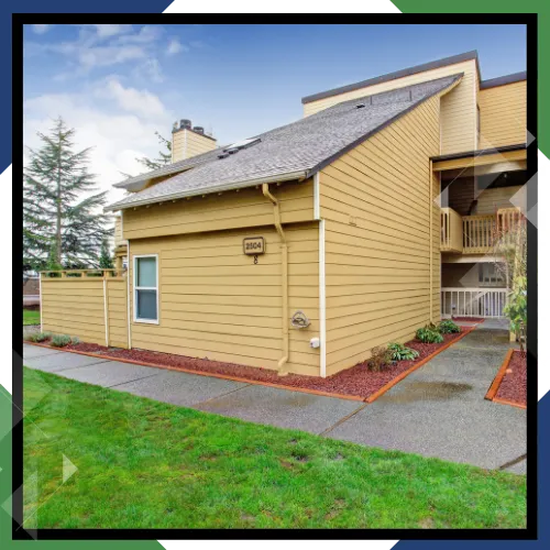 Local siding installers working on a Bellingham residential property