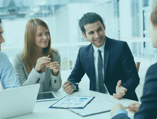 Professional business team having a meeting and discussing strategies in a modern office.