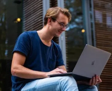 Business executive using tablet to manage virtual assistant tasks