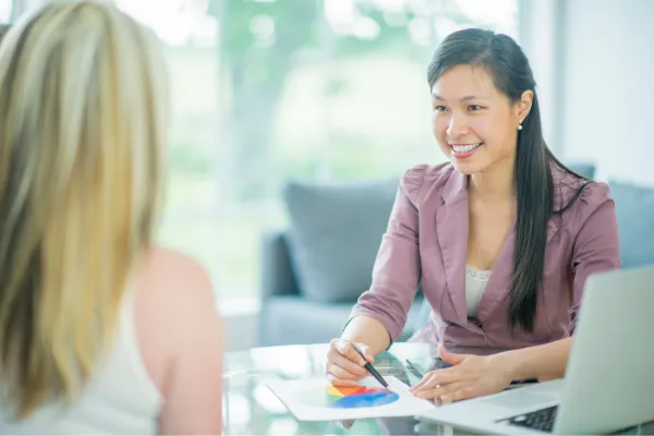 Business owner explaining helpful tips to client in a friendly consultation setting