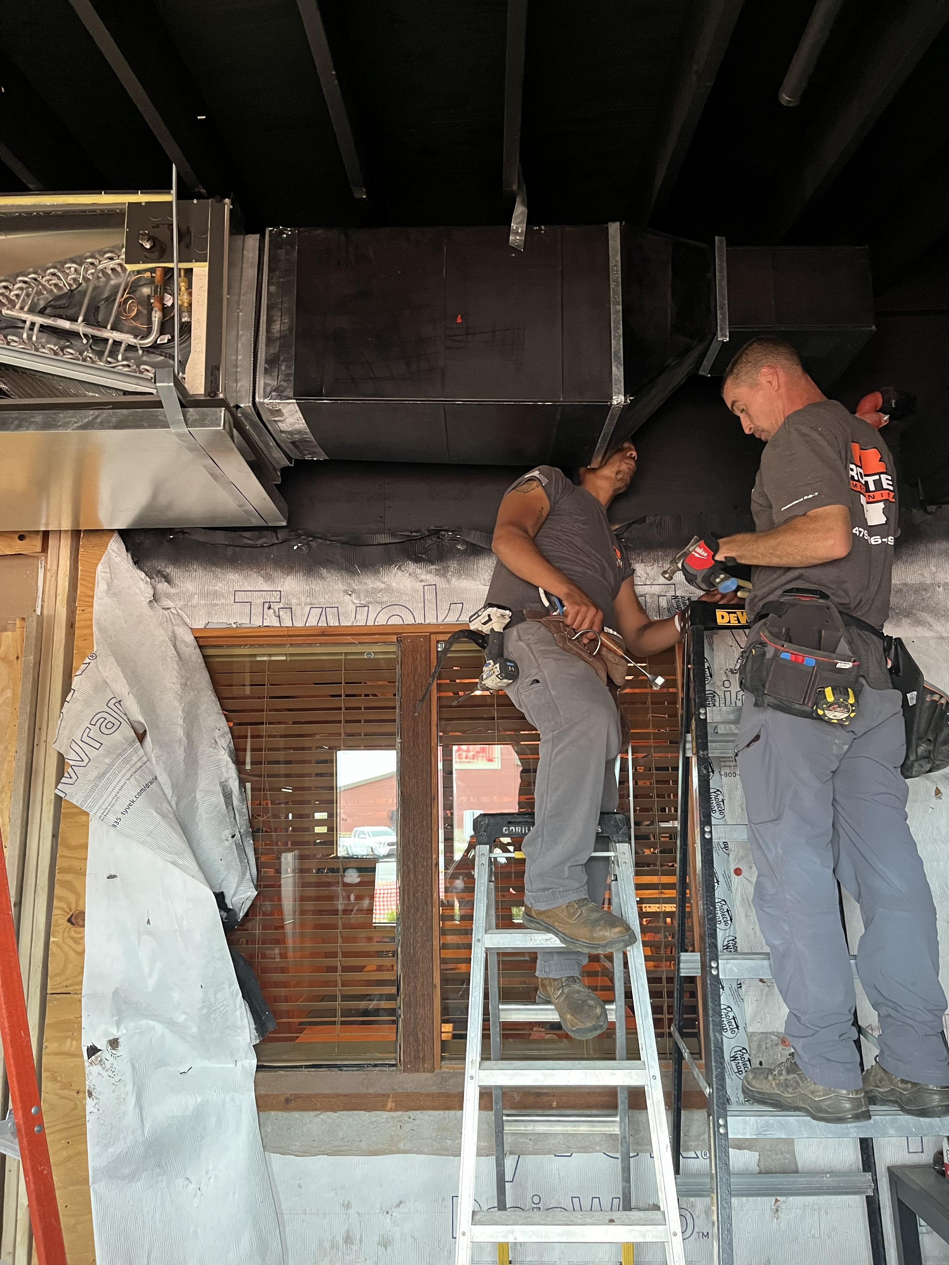 AC installation with new outdoor air conditioning units installed at a home in Northwest Arkansas