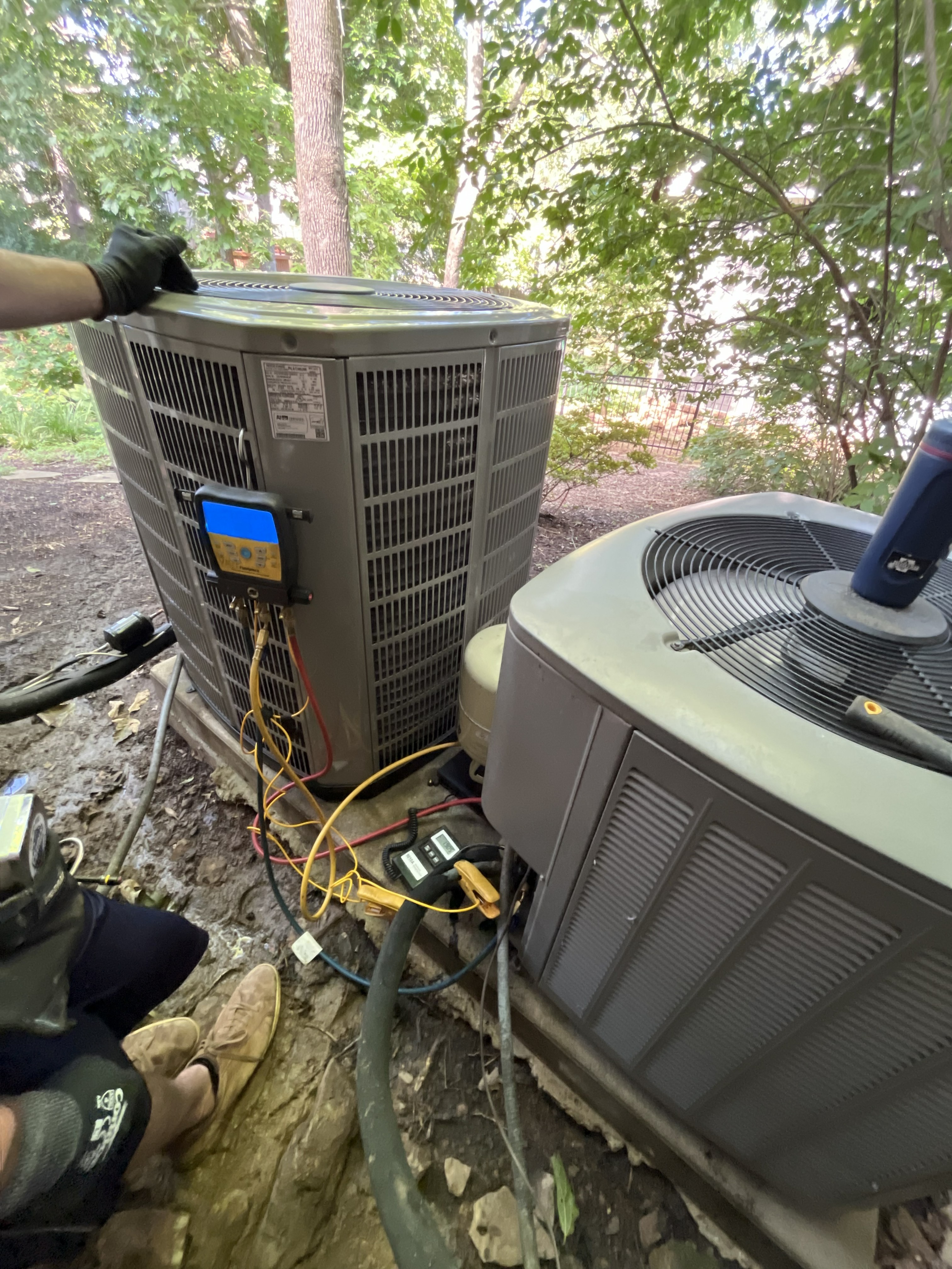 AC installation with new outdoor air conditioning units installed at a home in Northwest Arkansas
