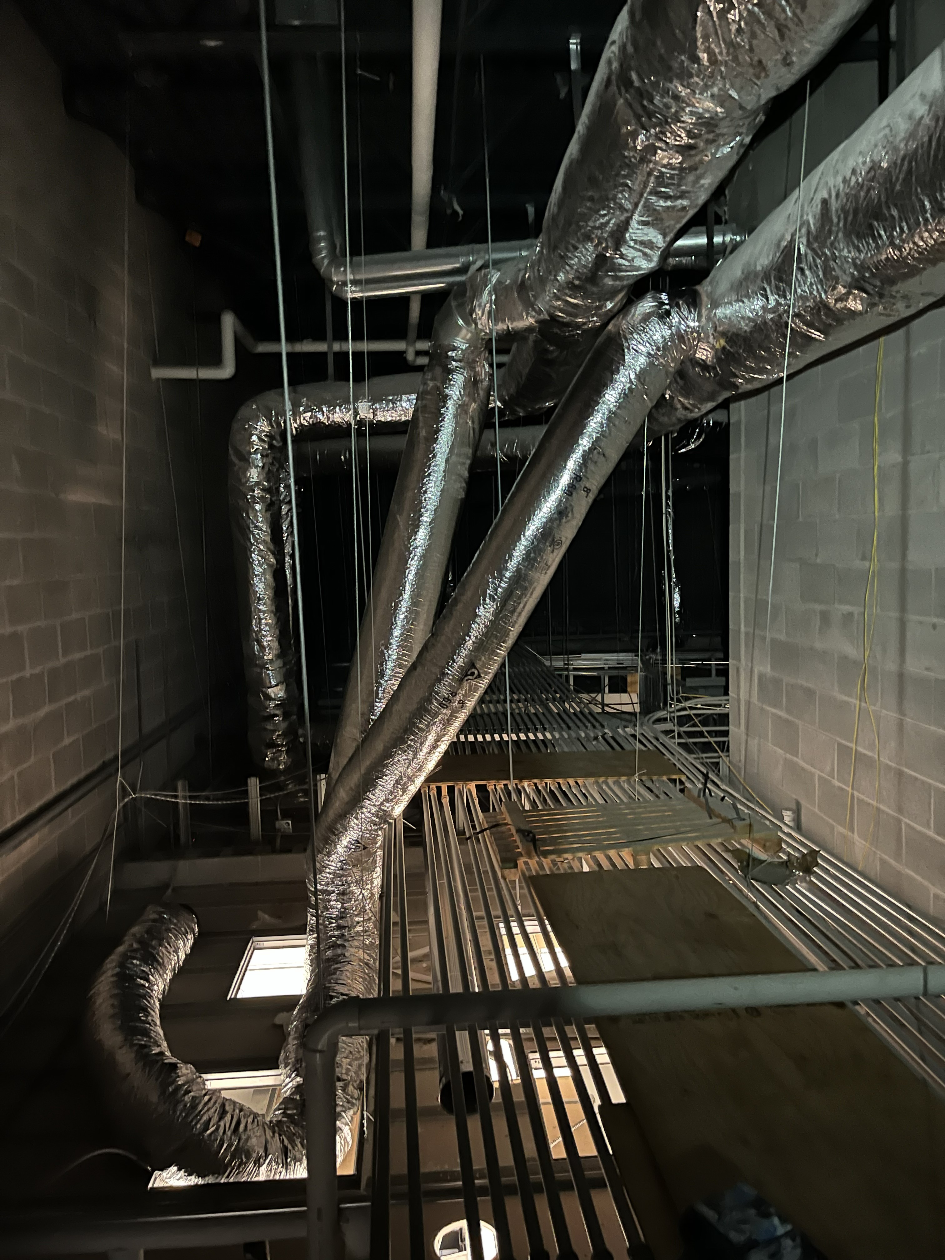 HVAC ductwork installation for new air conditioning system in Northwest Arkansas home