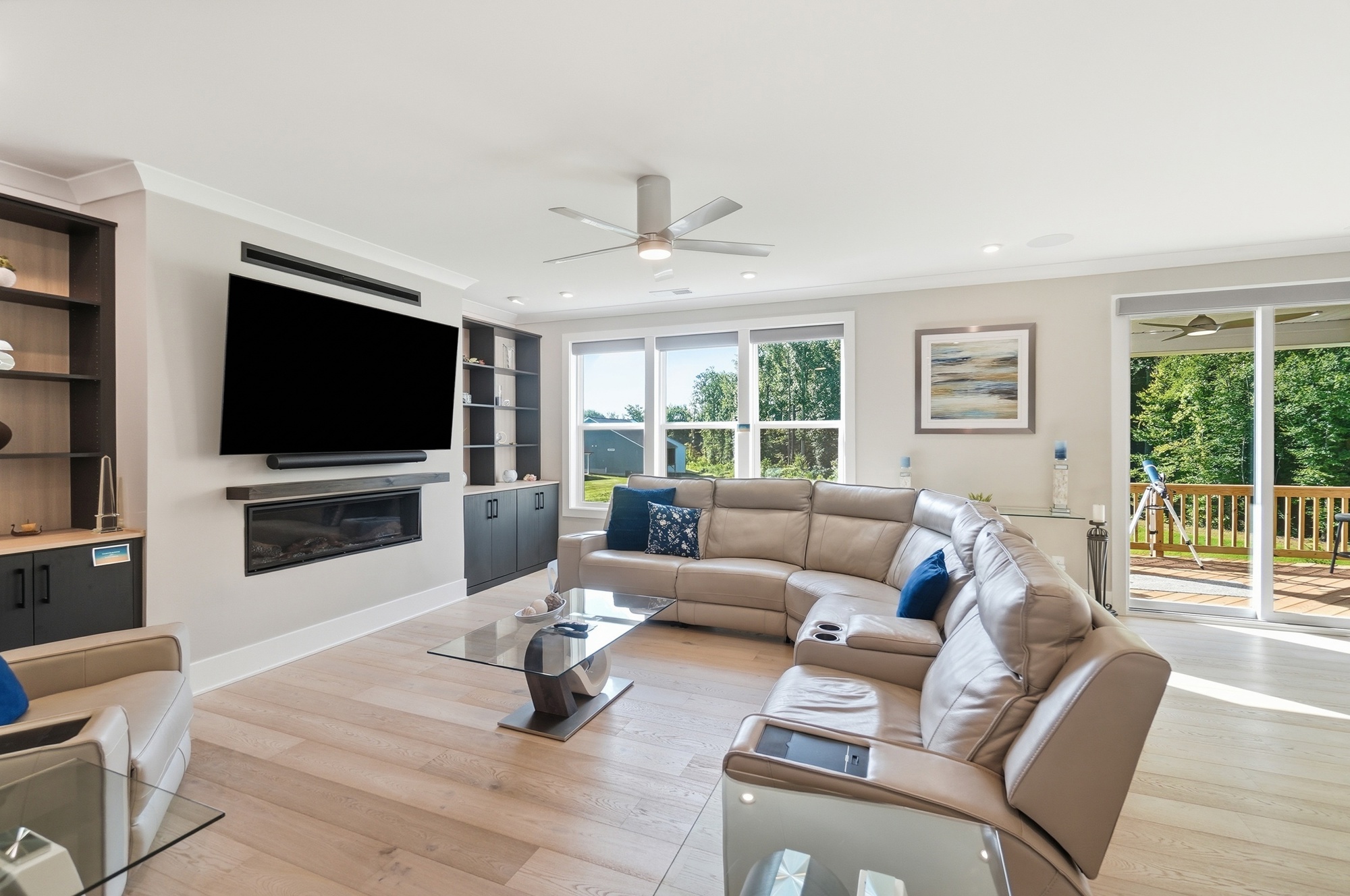 Open concept living area with high ceilings and hardwood floors
