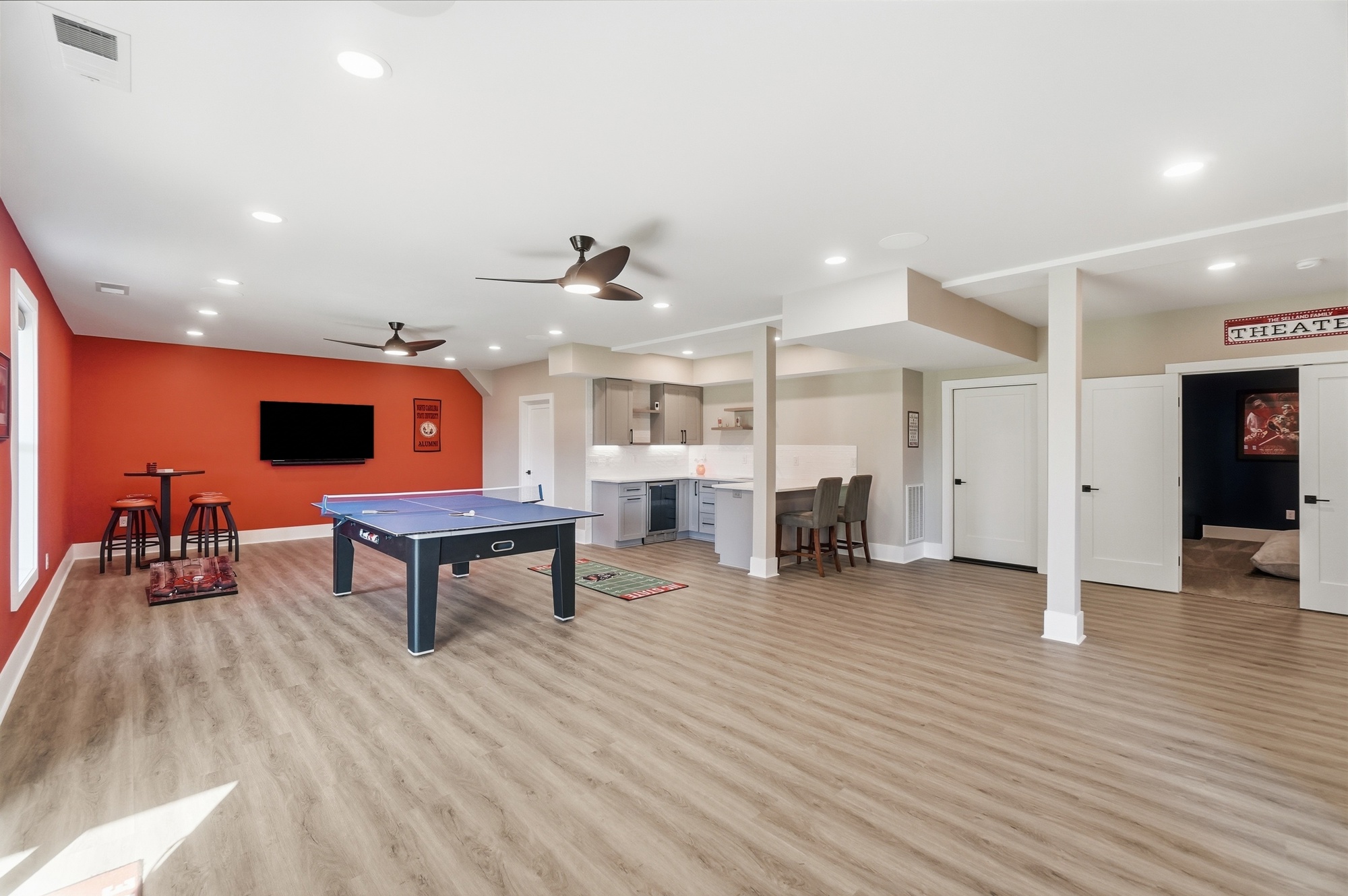 Open concept living area with high ceilings and hardwood floors