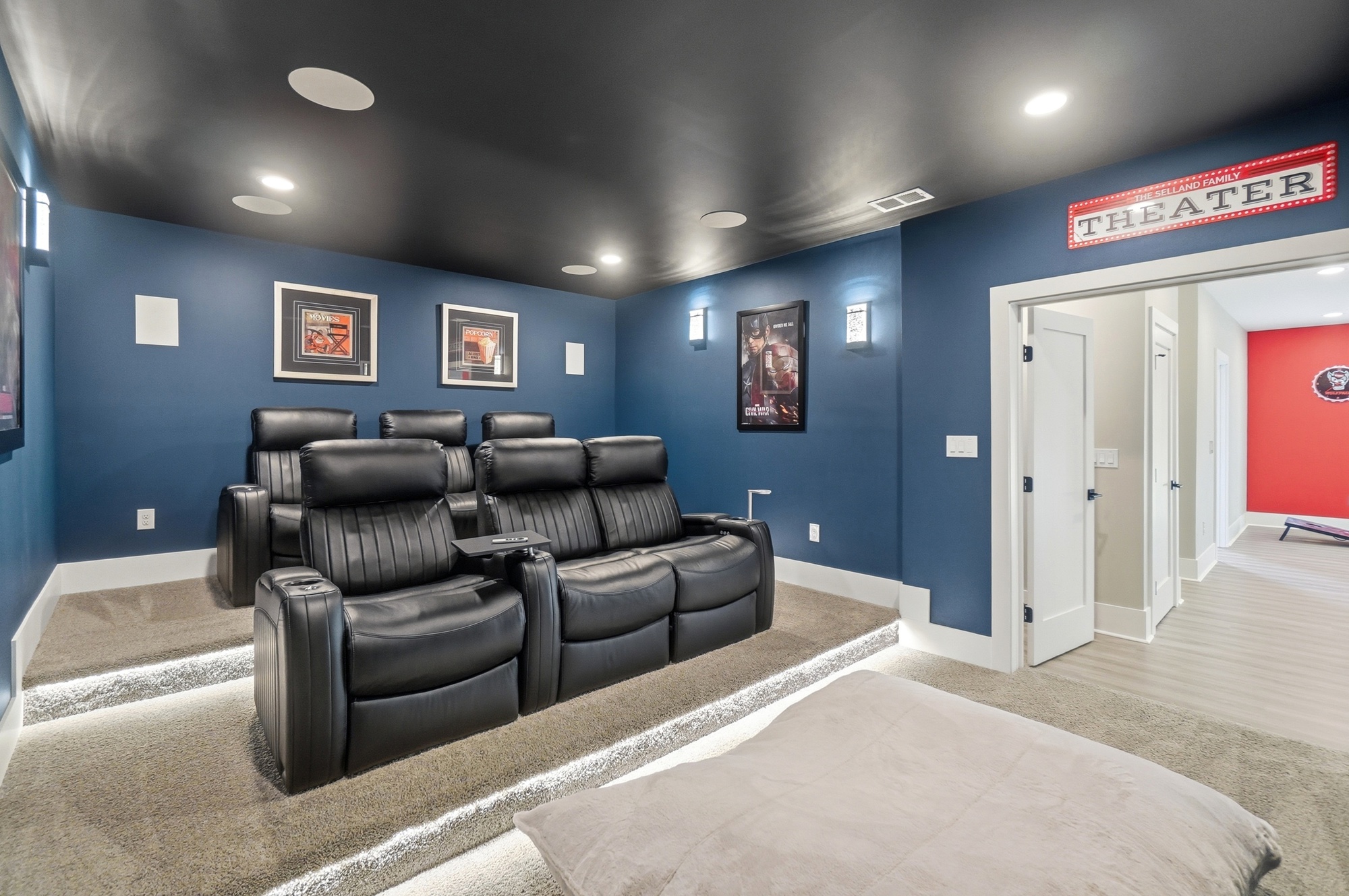 Open concept living area with high ceilings and hardwood floors
