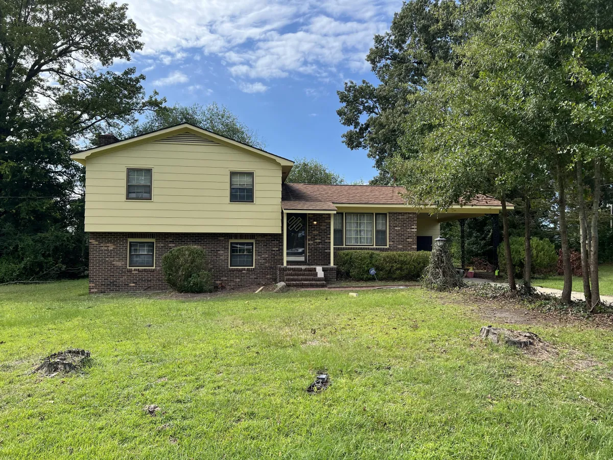 a small building with a lot of sticks sticking out of it