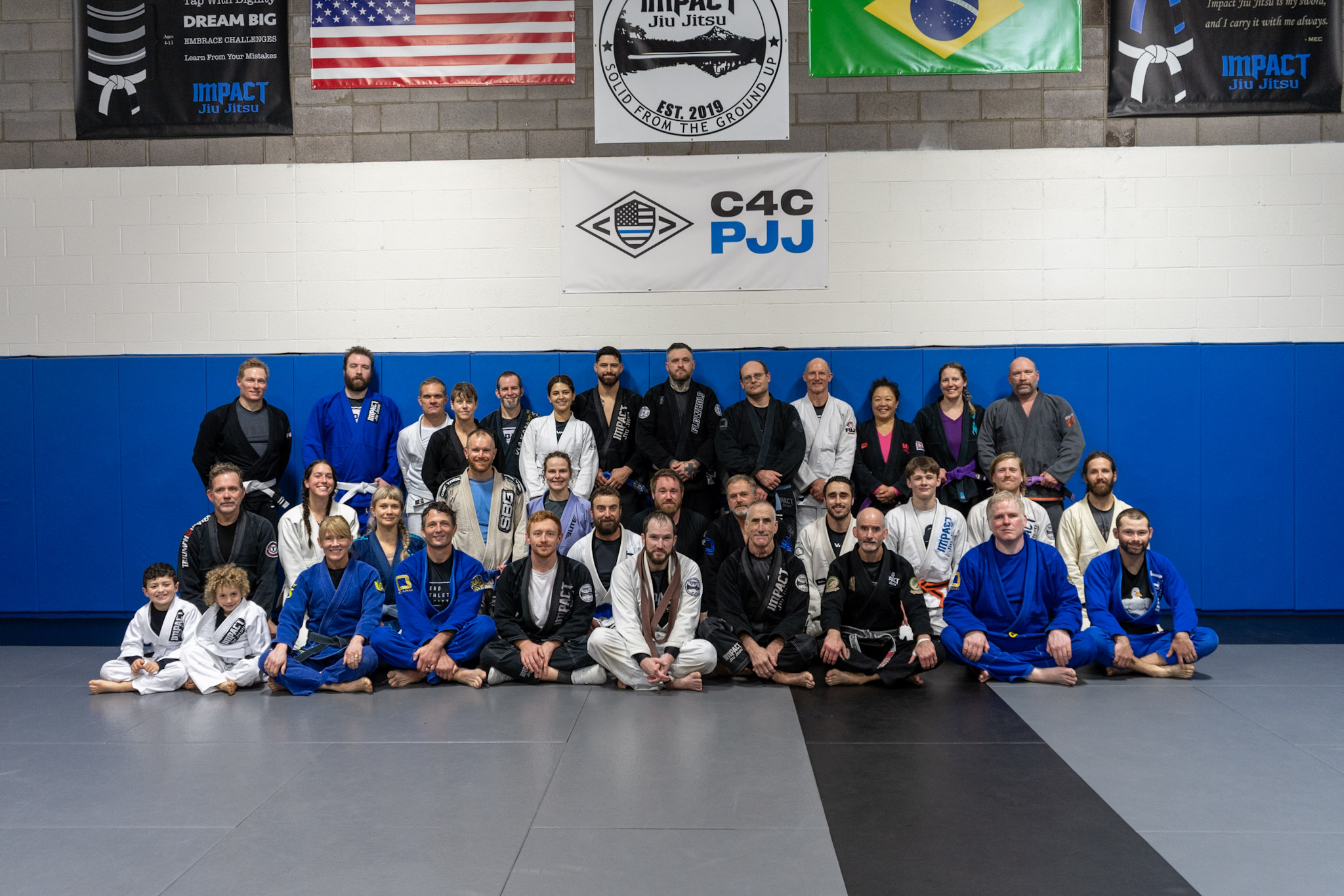 Adults and kids practicing Brazilian Jiu Jitsu at Impact Hood River