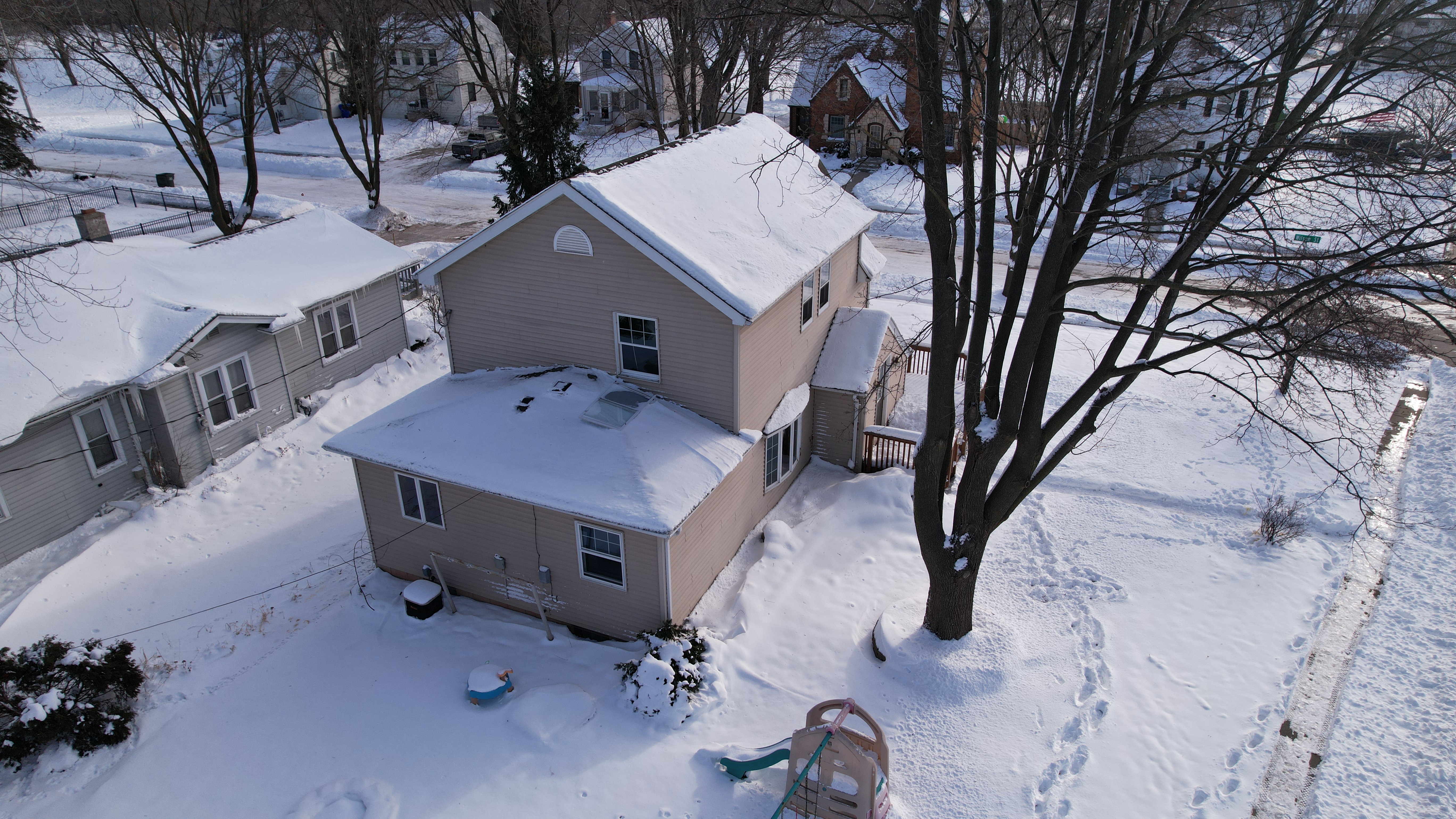 drone photo of suburban Kaukauna home in winter