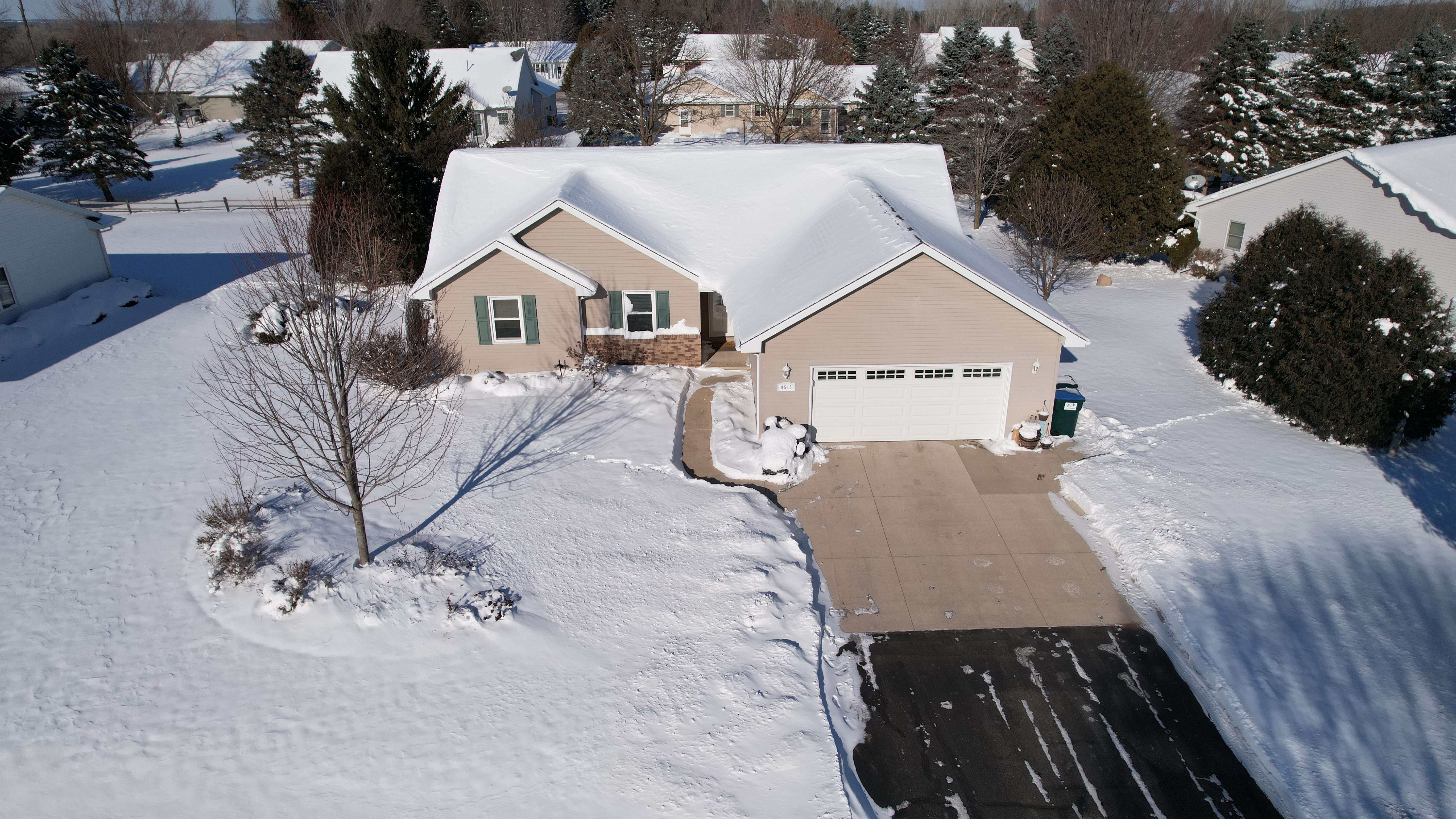 drone photo of suburban Appleton home in winter