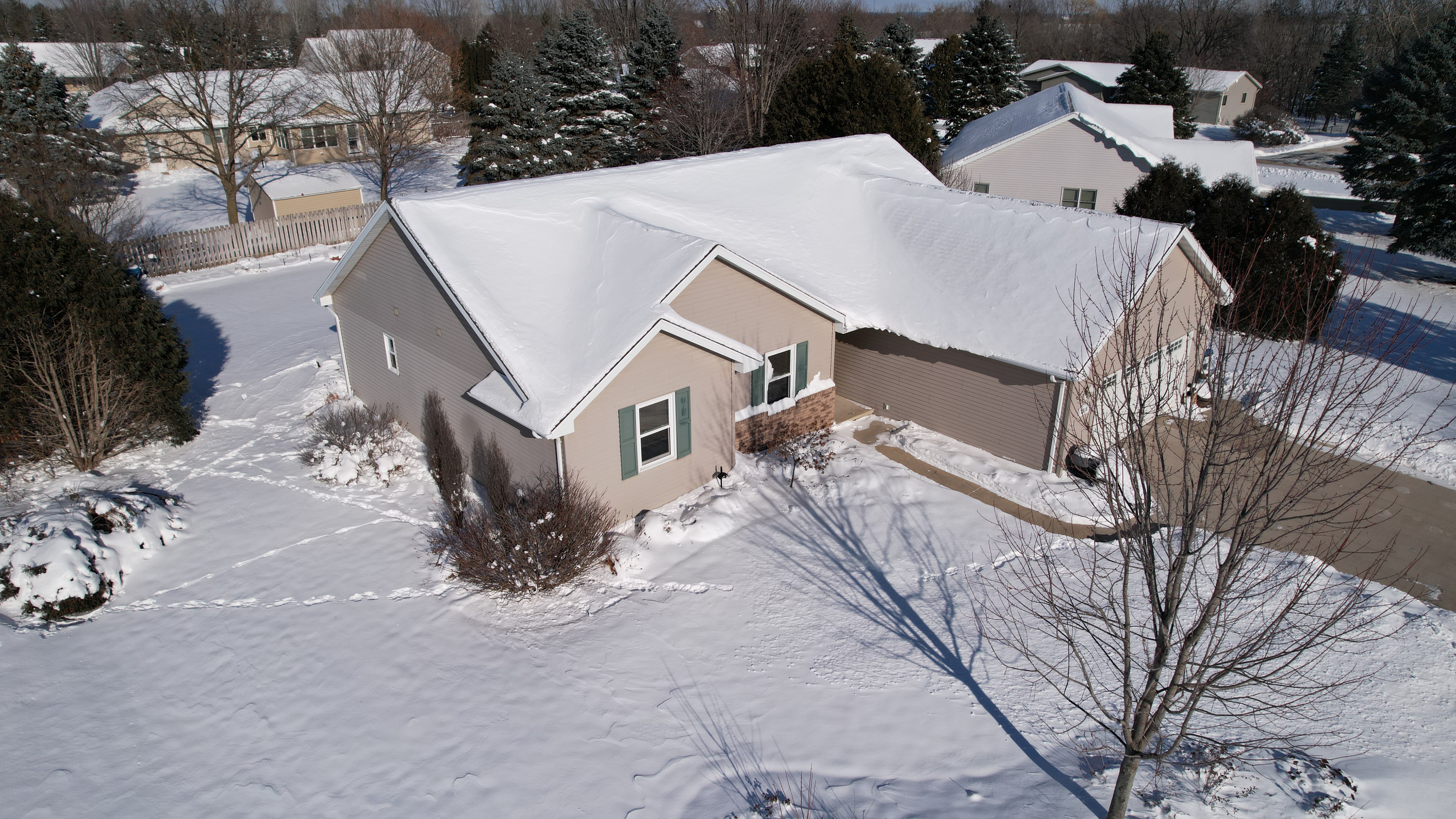 drone photo of suburban Appleton home in winter