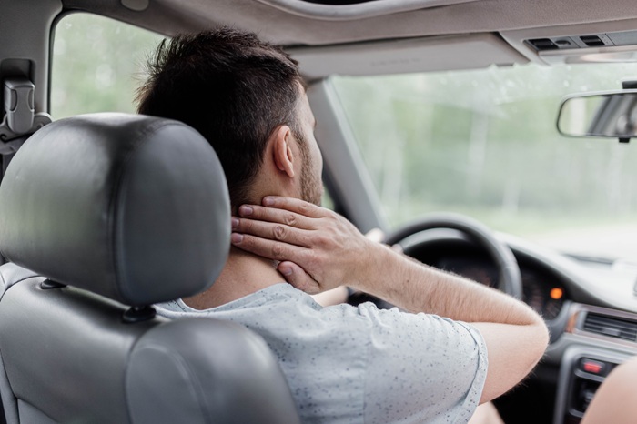 Man Suffering from Neck Pain Because of a Car Accident 