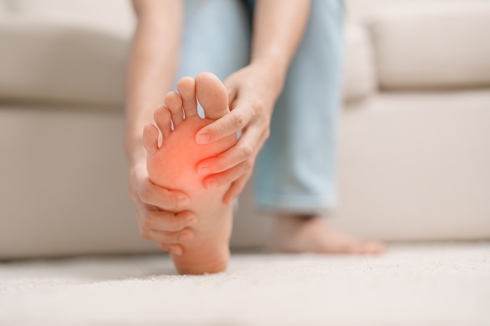 Women's Feet Suffering from Plantar Fasciitis