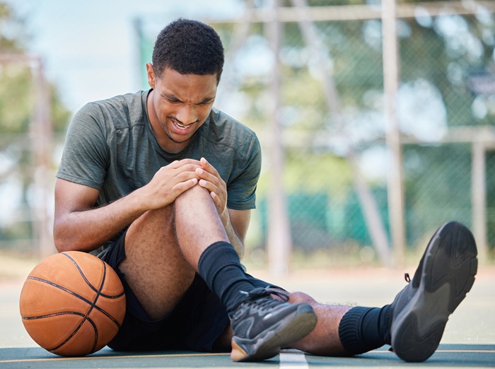 Young man with an Injury while playing basketball