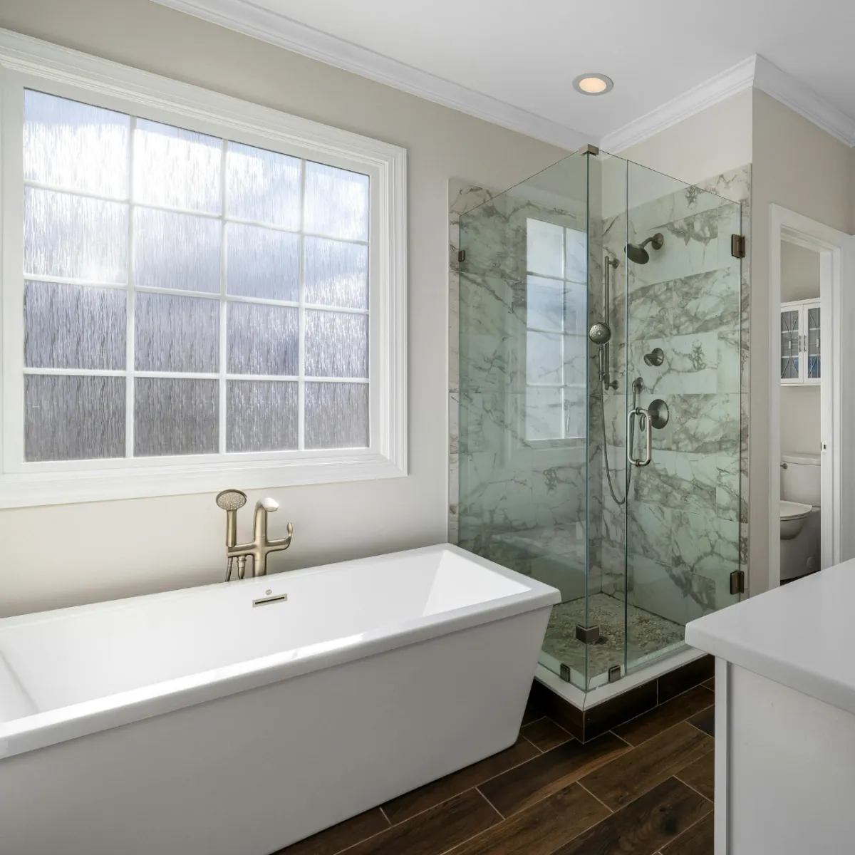 Fort Worth kitchen remodel with large island, quartz countertops, gray cabinetry, and modern pendant lighting.