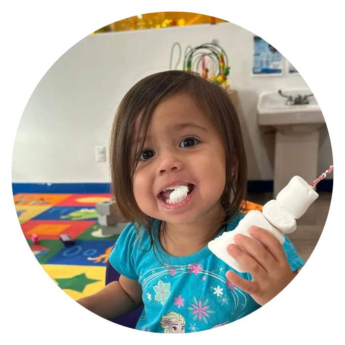 Happy Child in childcare facility painting