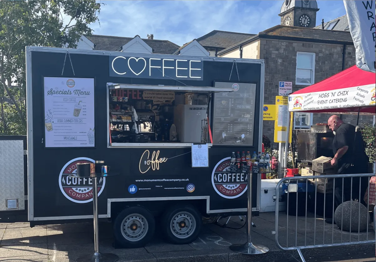The Monument Coffee trailer setup with menu