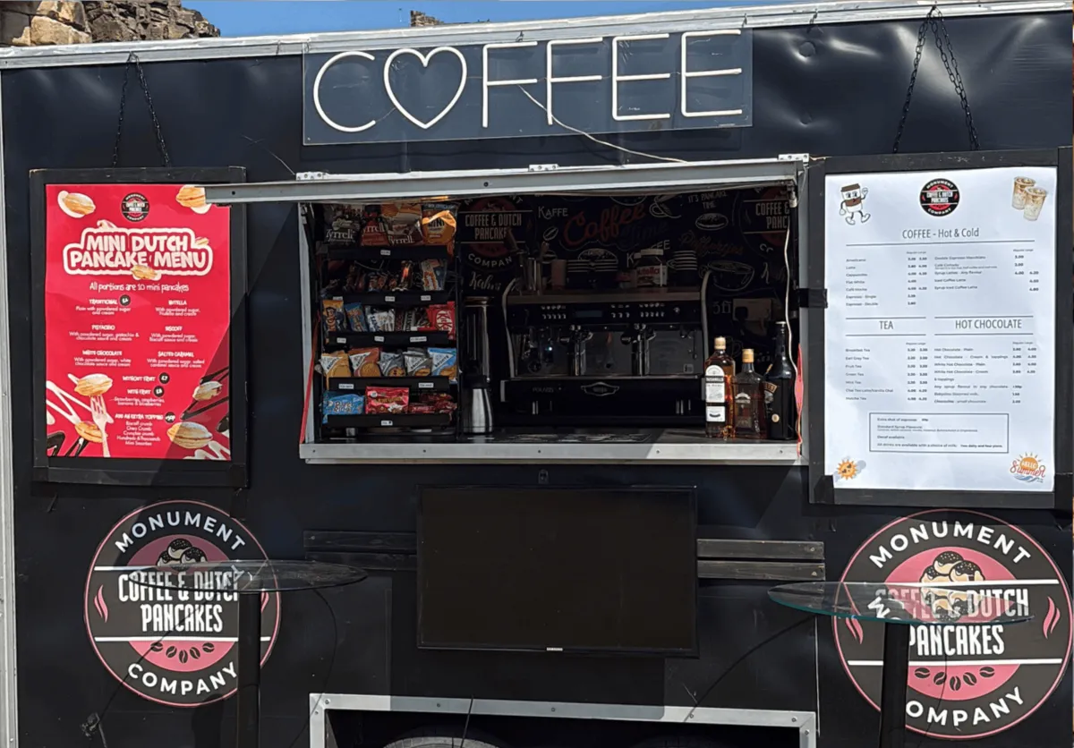 The Monument Coffee trailer setup with menu