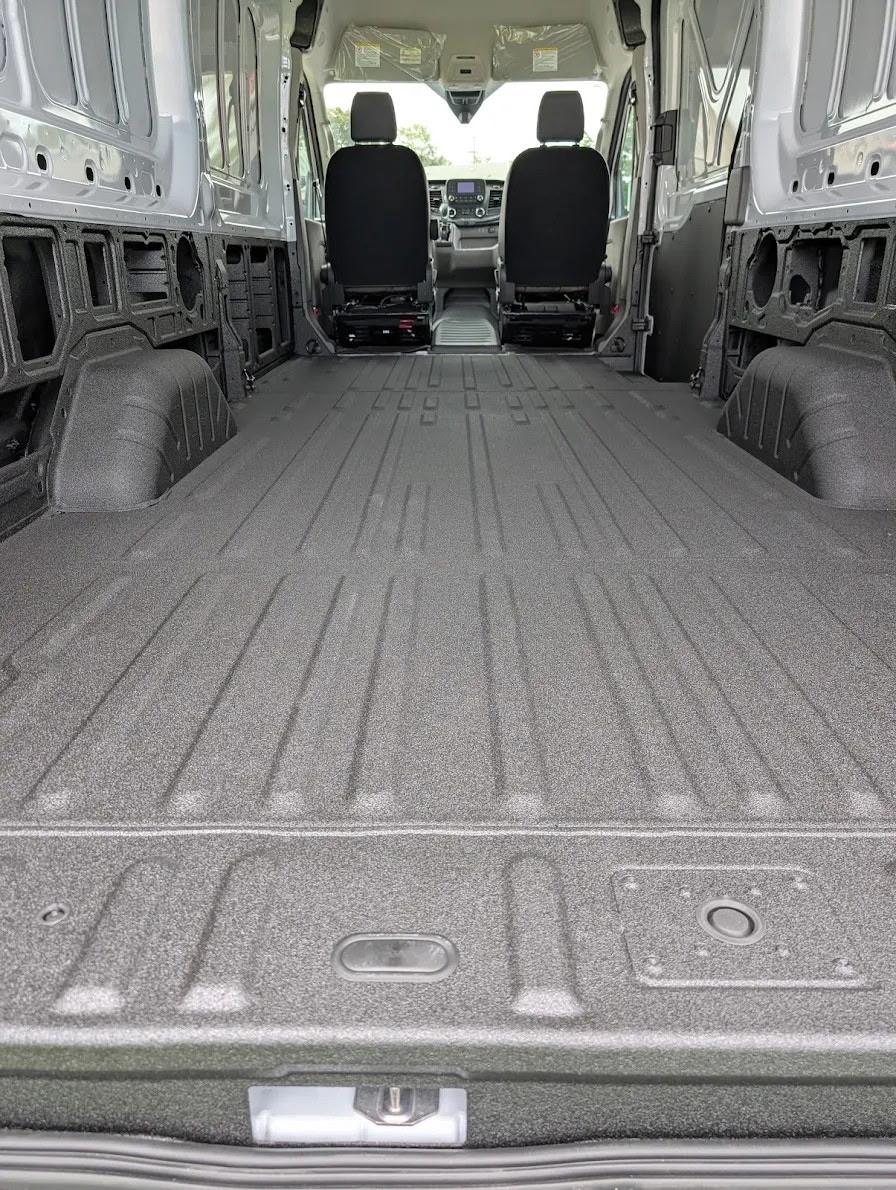 Midday workshop shoot of RidgeCraft Boltline cap mounted on a contractor pickup, crisp natural light, focus on hinge, gasket and cargo clearance, shallow depth of field to emphasize construction and finish — photorealistic functional view.