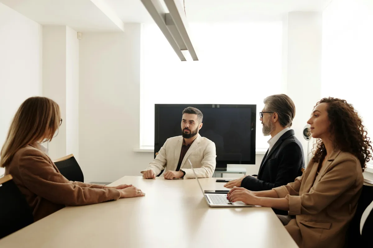 Business team meeting in a bright office to discuss continuity planning