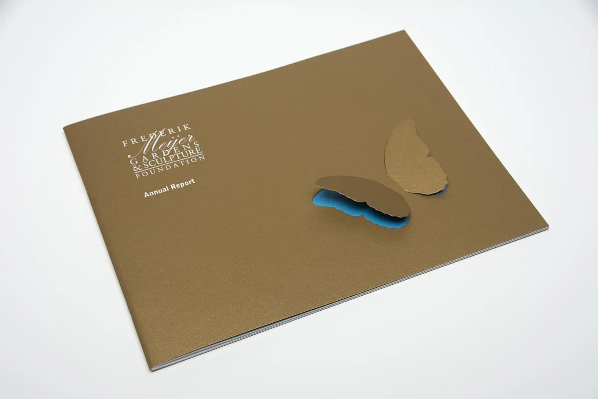 Annual Report with butterfly wings die cut to raise off page