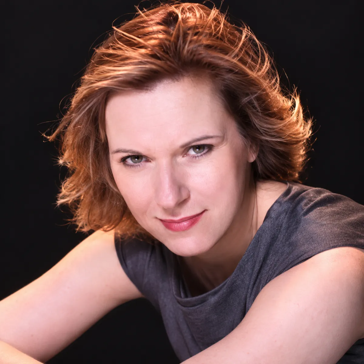 Carol, compassionate life and healing coach in a warm, light-filled studio space
