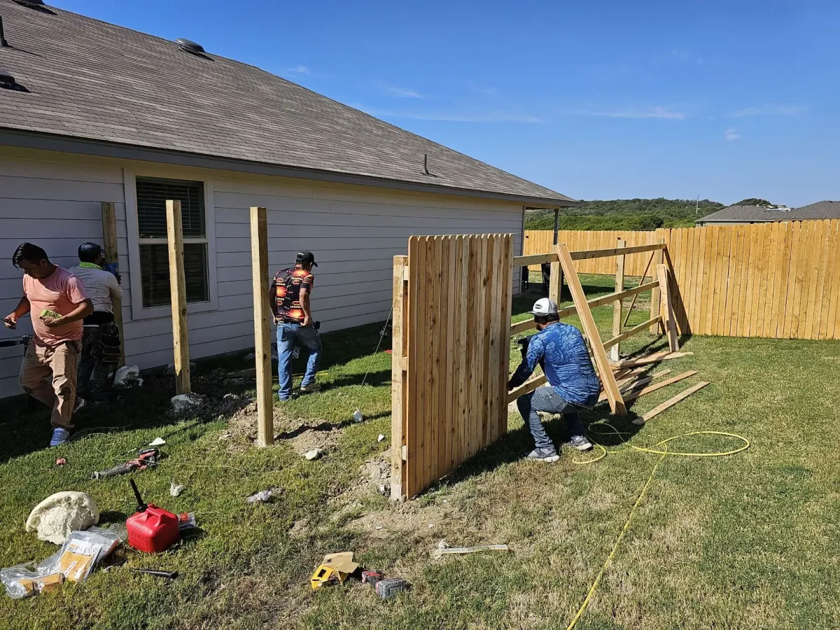 fence installers installing a fence