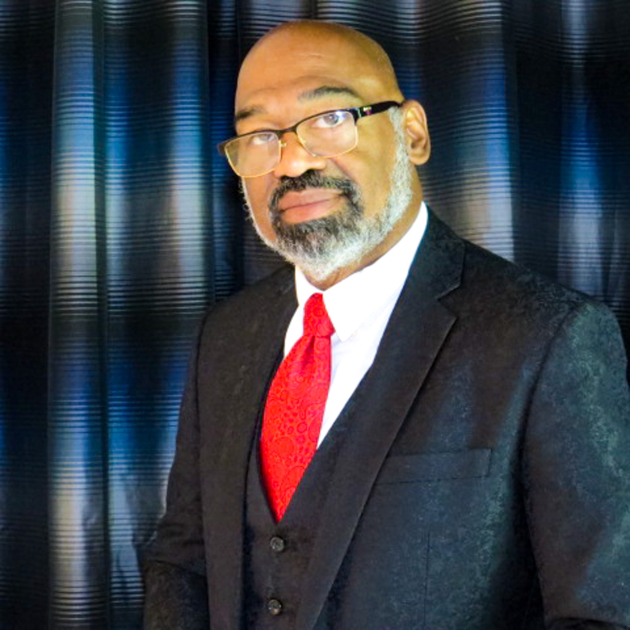 Frank Thompson Jr. - Black and white portrait with subtle gold highlight