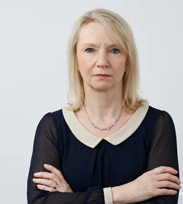 Carol Standing arms folded