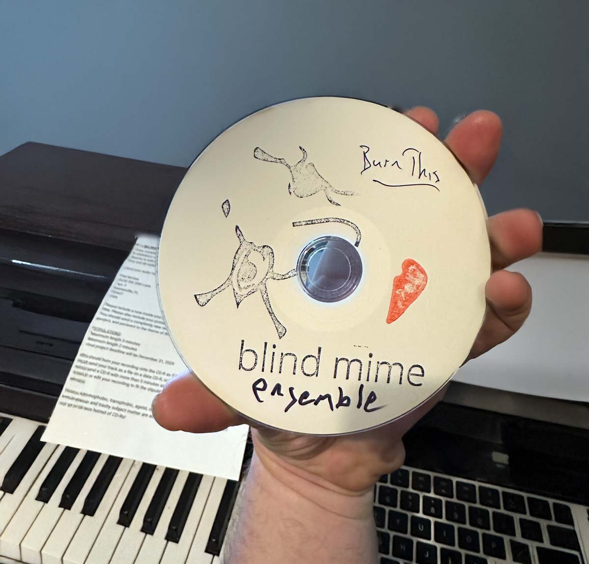 Burn This CD Project image of me holding my audio submission prior to mailing