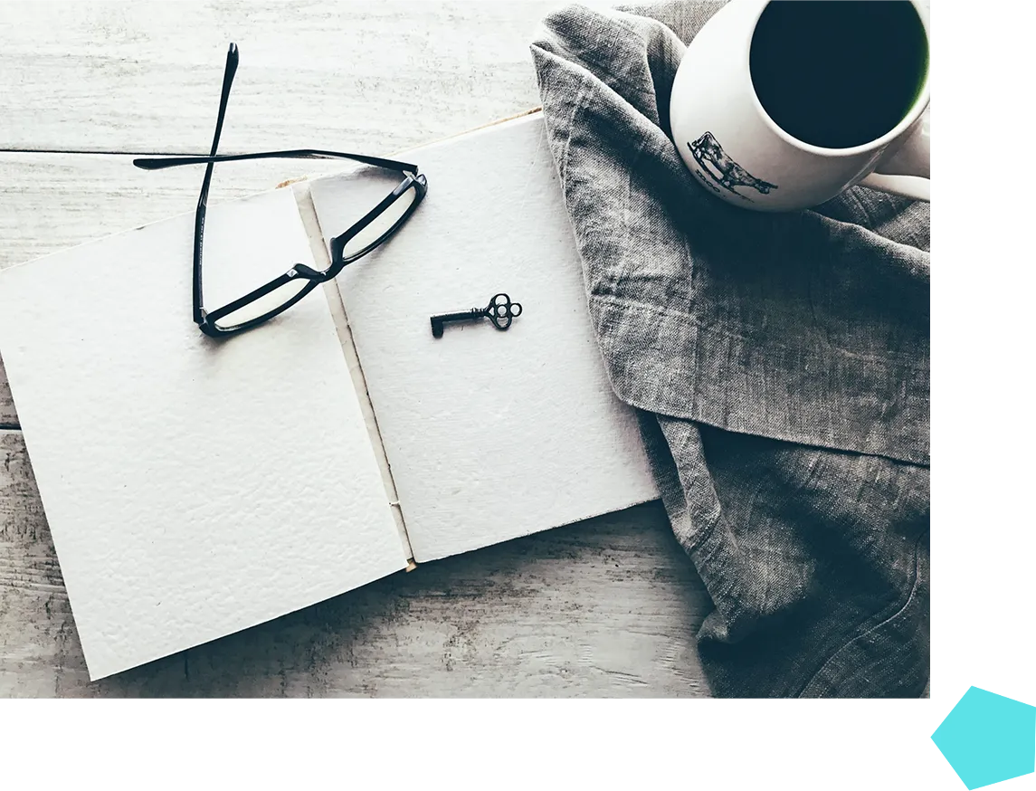 Journal with glasses and coffee