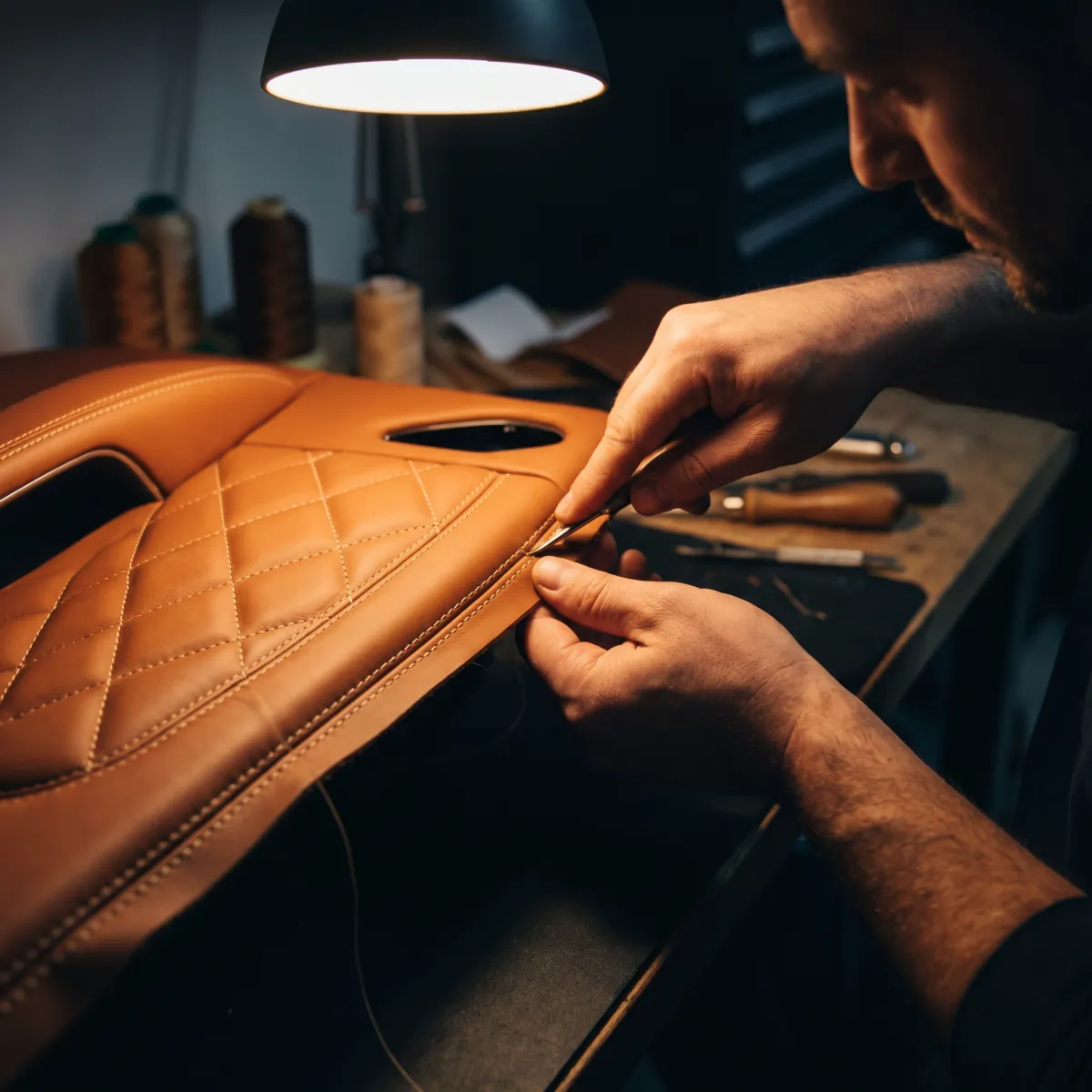 Custom leather door panel upholstery with diamond stitching by EM Upholstery Technology