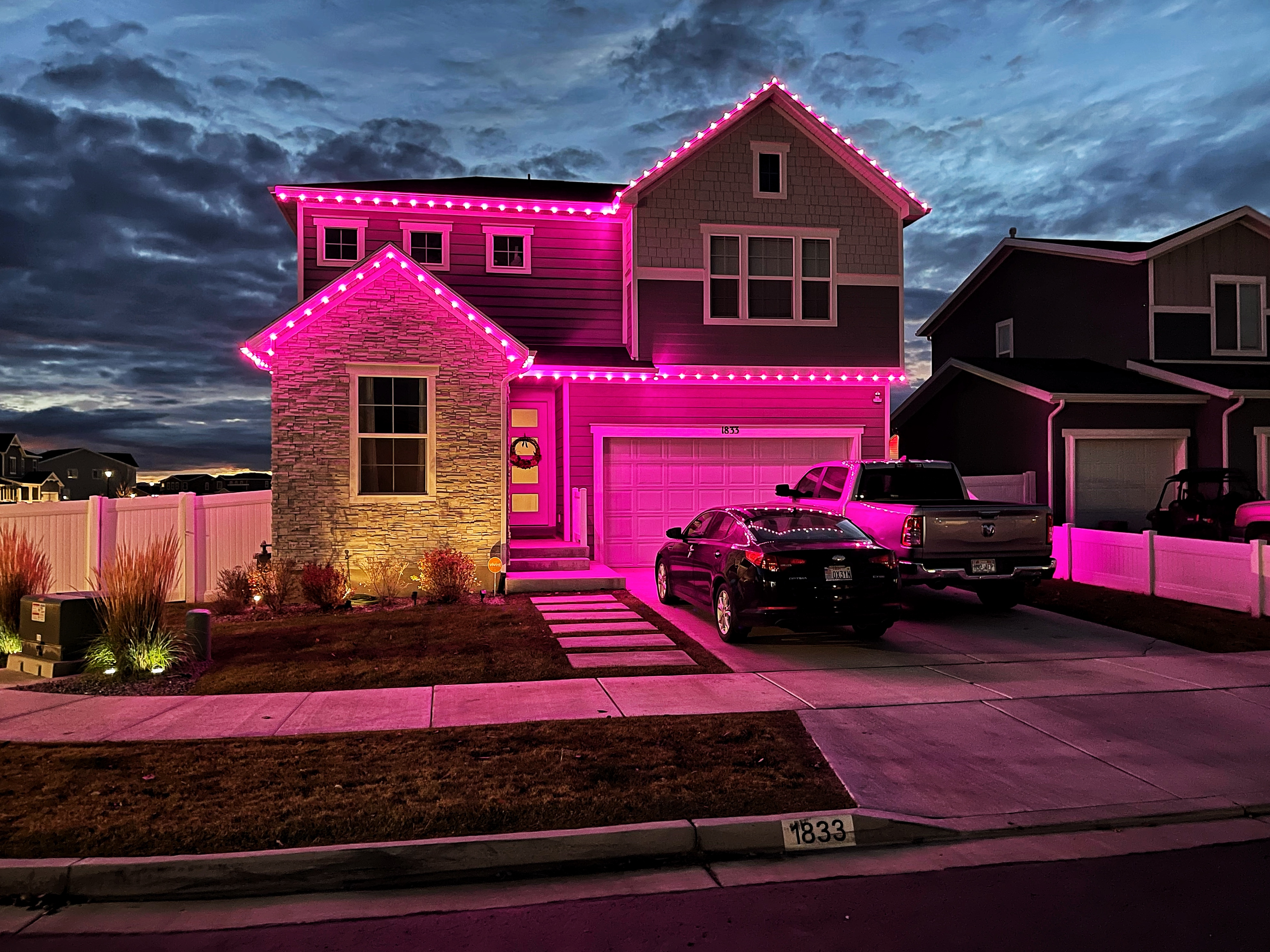 Holiday light installation on a home in Santaquin Utah by Max Mowing